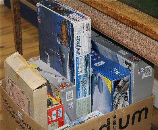 A collection of boxed model kits,